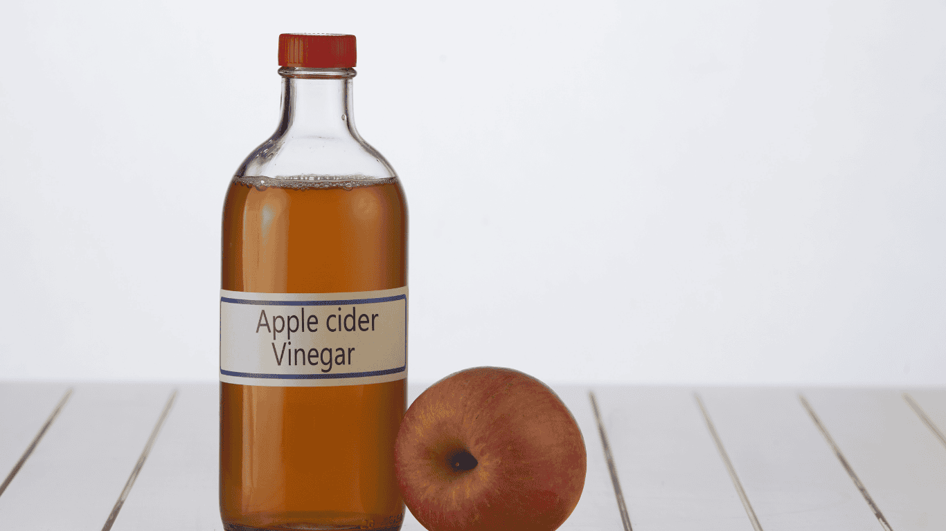 Apple cider vinegar used as a natural solution for how to get rid of ants in your home.